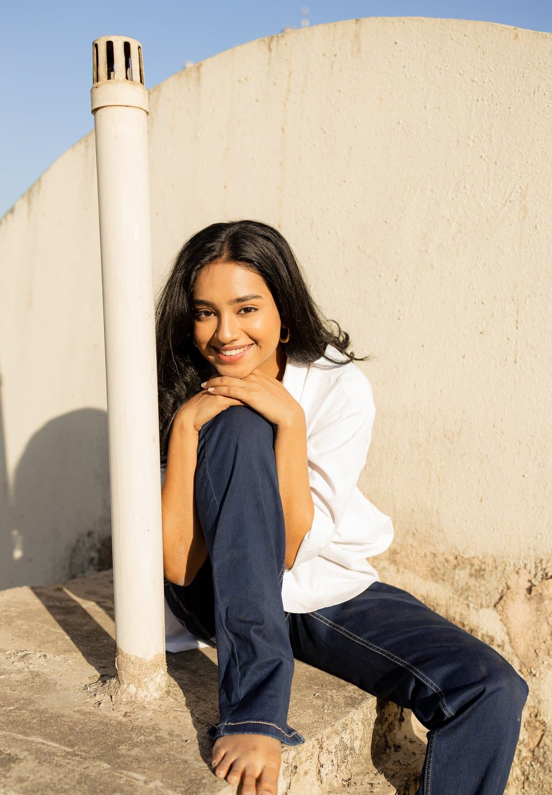 Malavika Chitoor on a rooftop in golden-hour light